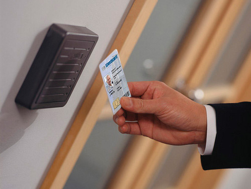access control keycard being waved in front of a reader